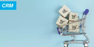 ecommerce et crm - caddie sur fond bleu